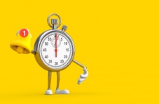 An illustration of a chrome clock with arms and legs holding a yellow bell with a red notification on a yellow background